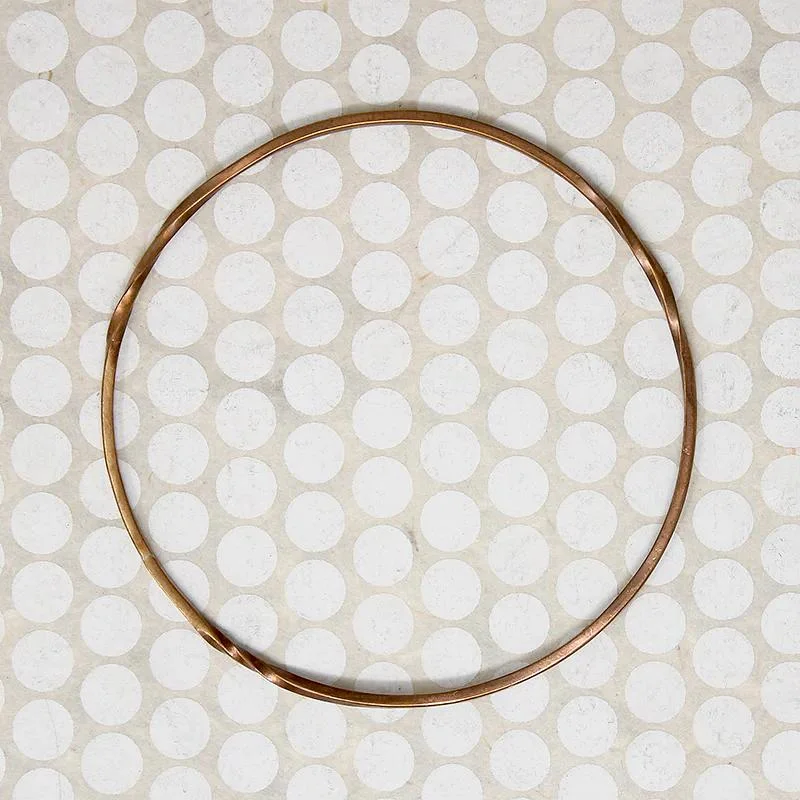 Simple Customizable Bangles with Heart Charms-The Endless Twist Round Bangle in Bronze from Allie B.