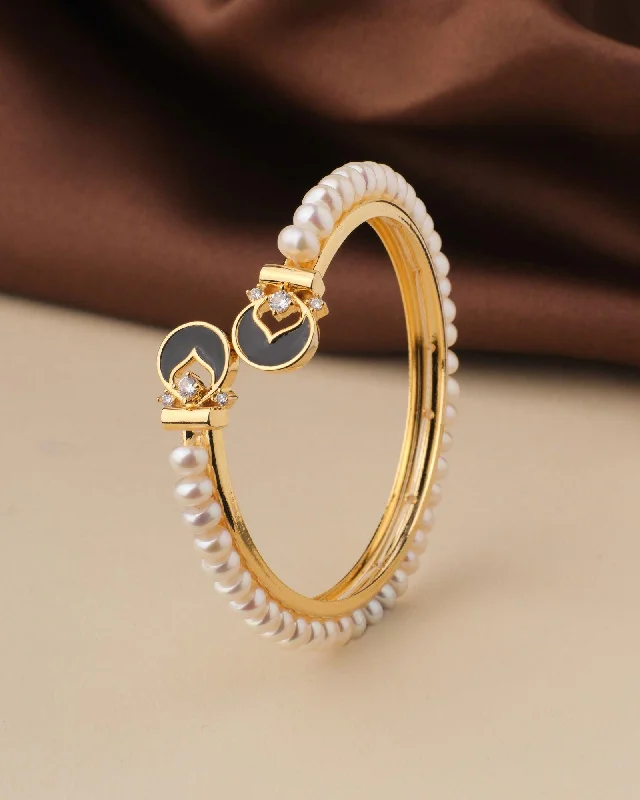 Custom Gold Bangles with Birthstone Inlays-Fashionable Stone Studded Pearl Bangle